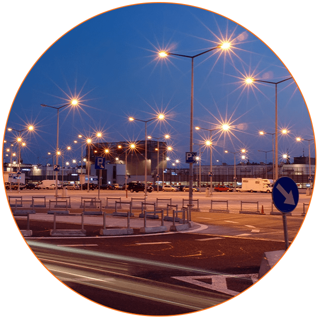 A circular picture of street lights at night.